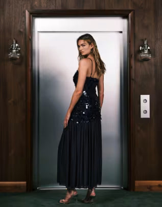 Model: 180.5cm / 5' 11'' | Wearing US 4 Rare London disc sequin sheer hem cami maxi dress in navy
